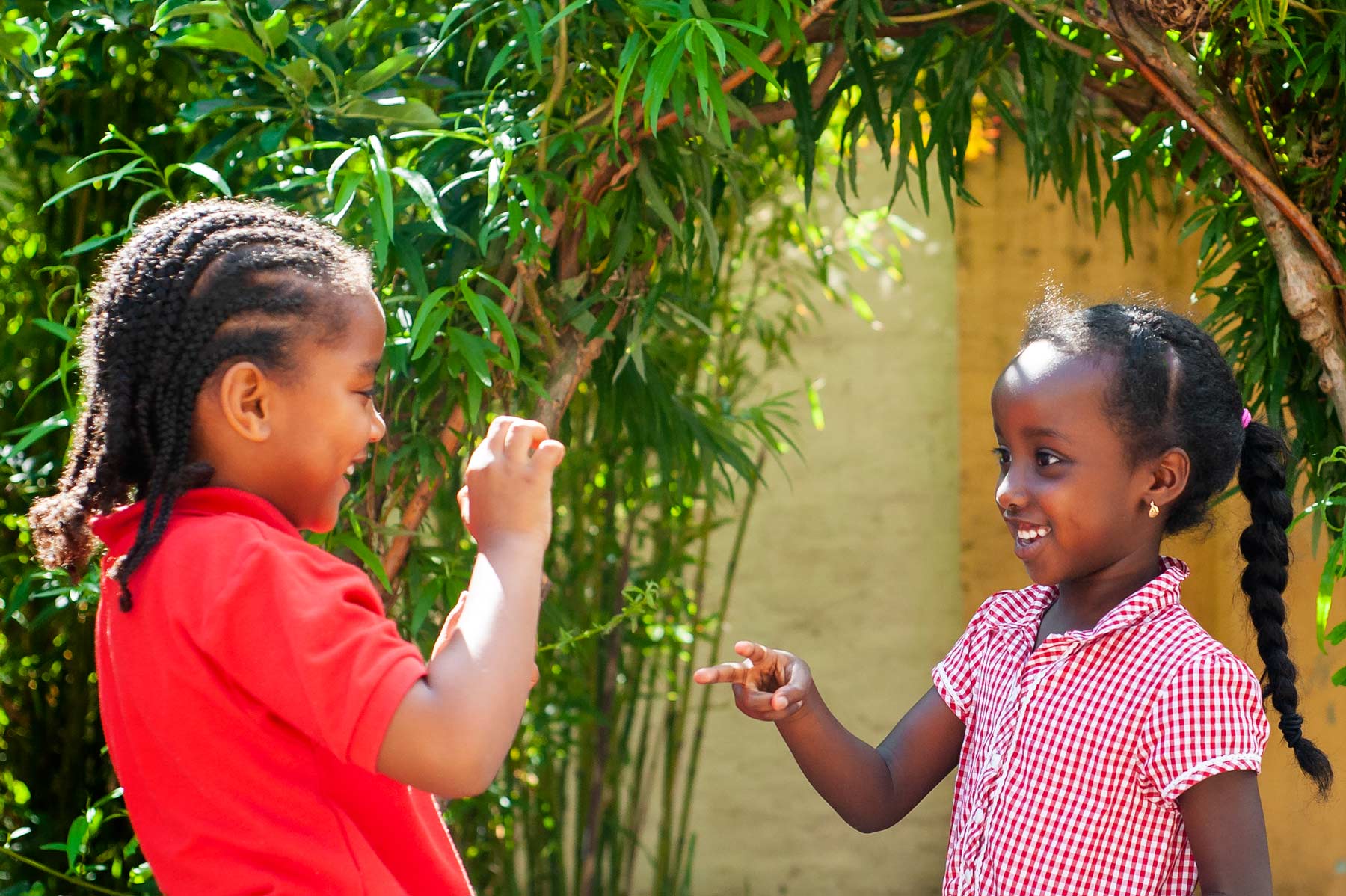 School pupils playing Rock Paper Scissors